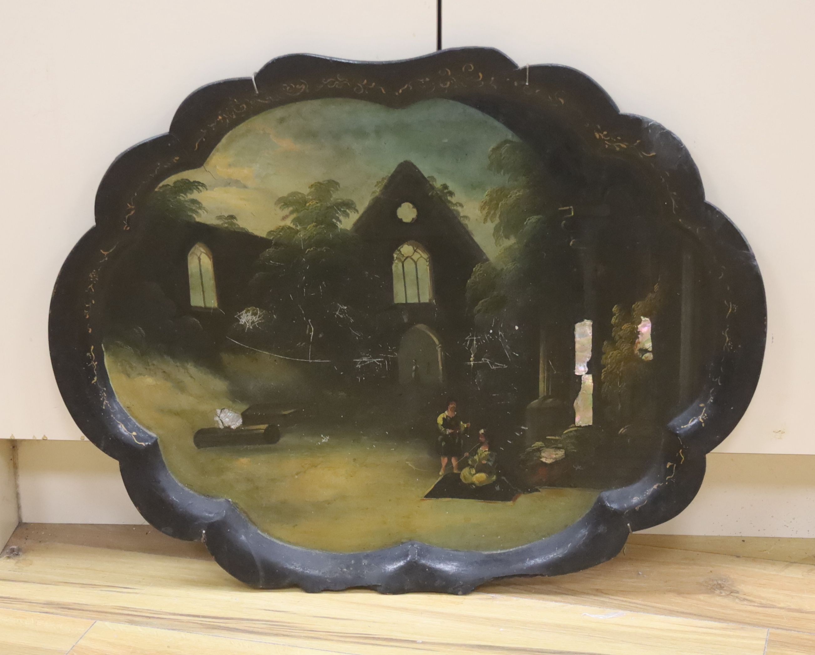 A Victorian papier mache tray, painted with Orientalist figures amongst ruins, 75cm (a.f.)